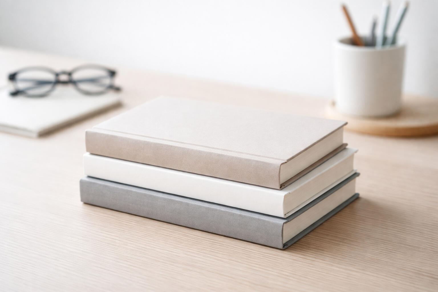 Mini Masters Series - Practical Business Guides for the Self Employed Practical business books for self employed professionals displayed on a clean timber workspace